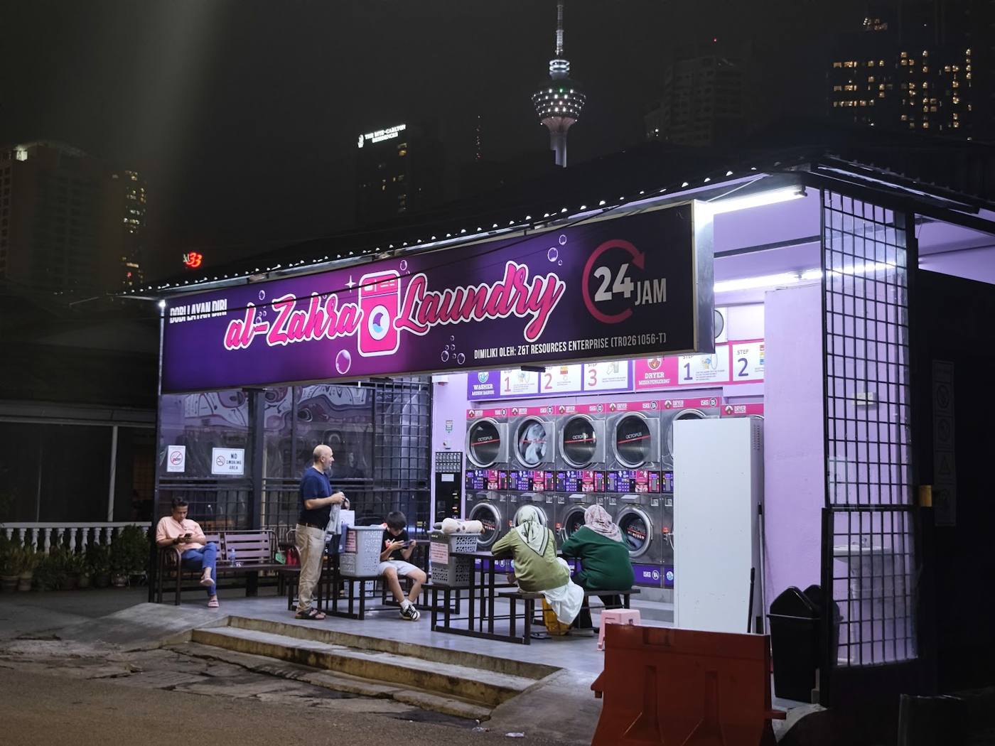 Shopfront at night with KL Tower